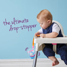 A child throwing his drink bottle of the high chair attached to a b.box connect a cup to stop it hitting the floor