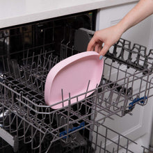 putting the tray in the top rack of a dishwasher