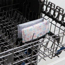 reusable small snack size bags turned inside out and put in the top rack of a dishwasher