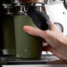 Barista making a coffee with an industrial coffee making using a Fressko Camino Stainless Steel Reusable Cup in Khaki