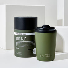 khaki green cup with black lid and packing in the same colour