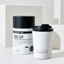White cup with black lid