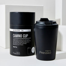 black cup with black lid and packing in the same colour