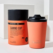 bold coral cup with black lid and packing in the same colour
