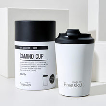 white cup with black lid