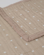 150cm x 180cm double sided taupe blanket with small white crosses and taupe edging