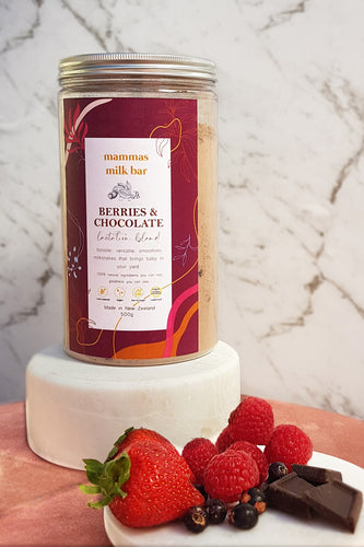 fresh berries and chocolate with a jar of lactation powder