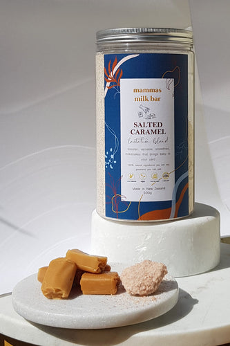 chewy caramel on a white plate in front of a large jar of powder