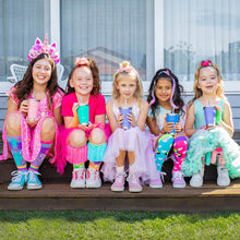 Five young children sitting on a step dressed in bright colourful outfits all holding smoothie cups