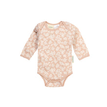 pale peach with white flowers all over it
