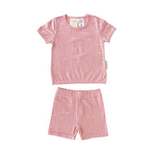 solid pale pink with small white stars all over in t-shirt and shorts pyjama set
