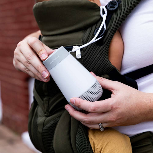 attached to a baby carrier showing its portabe